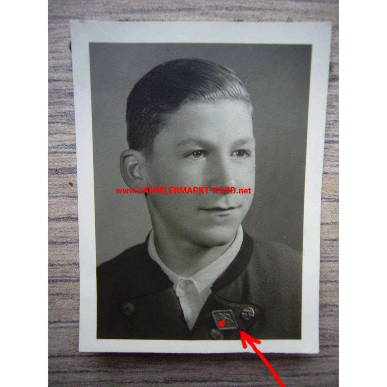 Portrait photo boy with NSFK tin badge