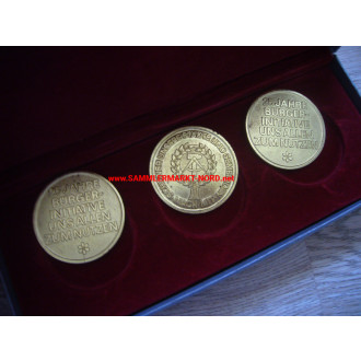 DDR - Medals in a case - 25 years citizens' initiative - NAW reconstruction work